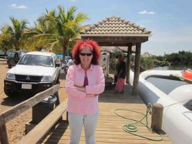 Howard Oldham's wife at dock on Hopkins, Belize – Best Places In The World To Retire – International Living